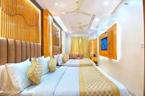 Katil atau katil-katil dalam bilik di Northern palace - 1 Min From Connaught Place & New Delhi Railway Station