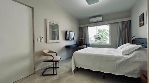 Katil atau katil-katil dalam bilik di Flat em Hotel com piscina, garagem, Wi-fi e Limpeza diária