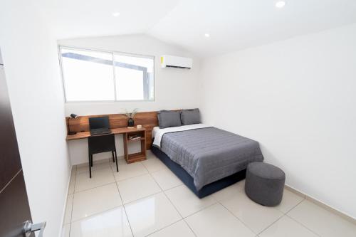 Ένα ή περισσότερα κρεβάτια σε δωμάτιο στο Quaranta Lofts