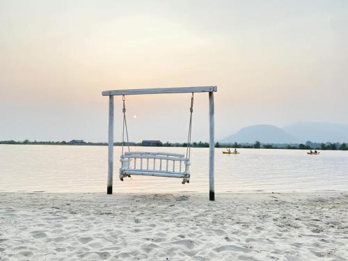 a swing on the beach near the water at Damboung Bungalow in Kampot