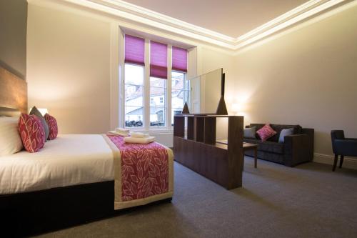 Кровать или кровати в номере Court Residence Aparthotel