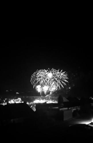 a black and white photo of fireworks at night at Springfield B6 in Brixham