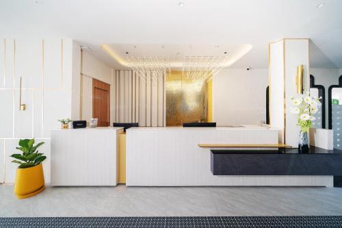 a salon with white counters and a yellow and black counter at Chalong Marina Bay View Rawai Phuket in Rawai Beach