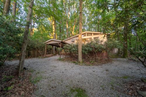 a house in the middle of a forest at Secluded Chalet near Ohiopyle and Seven Springs in Acme