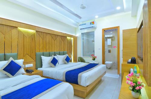 Katil atau katil-katil dalam bilik di Northern palace - 1 Min From Connaught Place & New Delhi Railway Station