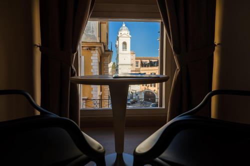 a table in front of a window with a view of a building at Hotel Scalinata Di Spagna in Rome