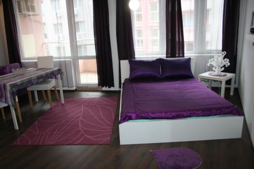 Cama o camas de una habitación en Purple Orange Studios