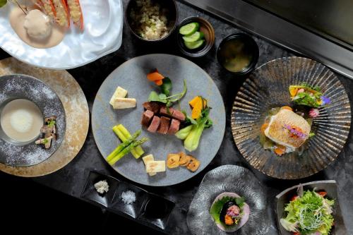 a group of plates of food on a table at 皆玉邸 恵 in Sakaiminato