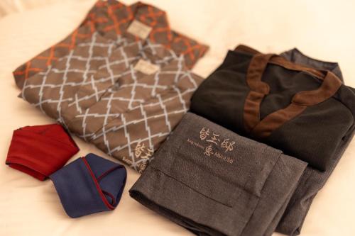 a group of ties sitting on a table at 皆玉邸 恵 in Sakaiminato