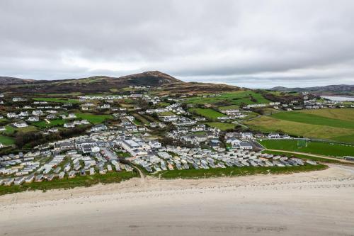 an aerial view of a beach and houses at Beach Park House in Downings