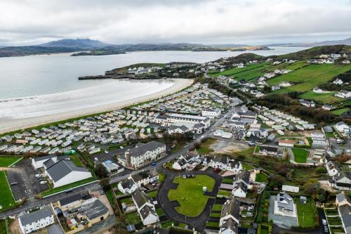 an aerial view of a town next to the beach at Beach Park House in Downings