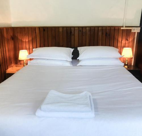Postel nebo postele na pokoji v ubytování Xanadu Homes