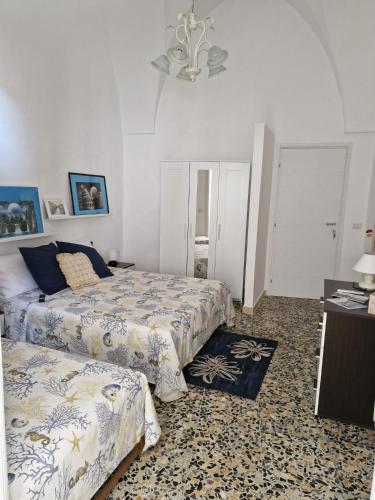 Кровать или кровати в номере Pietra su Pietra Casa Vacanze