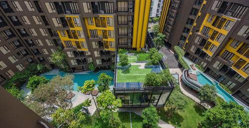 an aerial view of an apartment complex with a swimming pool at The Base Central Phuket in Phuket