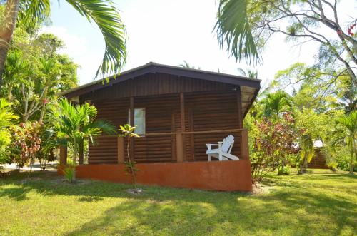 a cabin in the yard of a resort at The Log Cab-Inn in San Ignacio