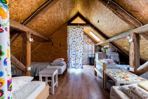 a room with four beds in a attic at Kawalerski, Impreza, Wesele in Miechowice Wielkie
