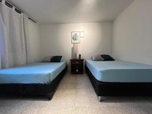 Postel nebo postele na pokoji v ubytování Habitación Laureles la castellana