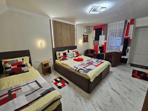 a hotel room with two beds in a room at Villa Magnat in Berehove