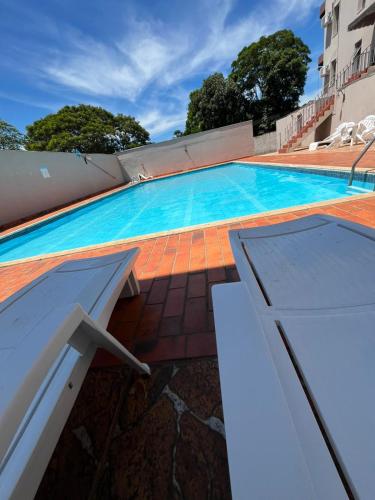 a swimming pool on top of a house at Tulipa Hotel in Foz do Iguaçu