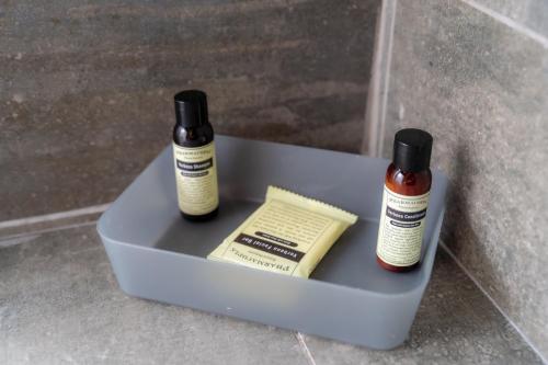 two medicine bottles sitting on top of a box at Lilan Nature, Modern House N°1, private swimming pool. in Cahuita