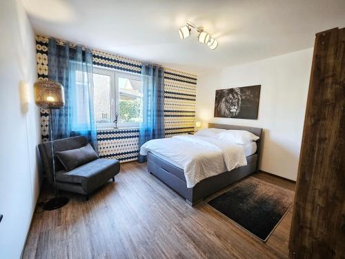 Postel nebo postele na pokoji v ubytování Schölerberg Appartement l ruhige Lage l nah an Zoo