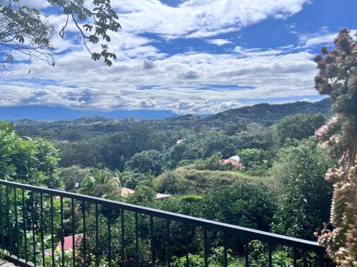 a view of the mountains from a balcony at Hotel Villas de la Colina in Atenas