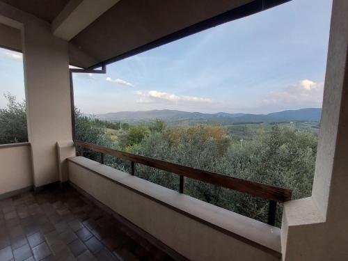 a balcony with a view of the mountains at Villa Decimo in L'Ugolino