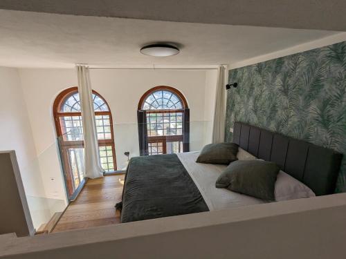 Posteľ alebo postele v izbe v ubytovaní mini loft Lido with own sunny & private garden