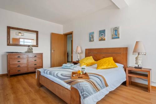 a bedroom with a bed with a tray on it at Tornos in Funchal