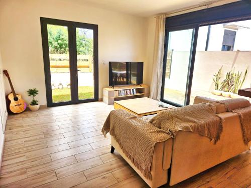 a living room with a couch and a fireplace at Villa des trois singes in Saint-Pierre