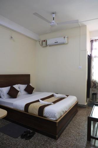 a bedroom with a bed in a room at Hotel Embassy in Dibrugarh