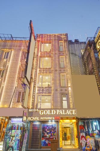 a tall building with a sign for a gold palace at Hotel Gold Palace - 03 Mins Walk From New Delhi Railway Station in New Delhi