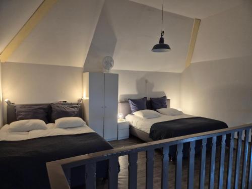 Ένα ή περισσότερα κρεβάτια σε δωμάτιο στο Noord-Hollands Hof Dream