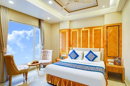 a bedroom with a large bed and a window at Hotel Gold Palace - 03 Mins Walk From New Delhi Railway Station in New Delhi
