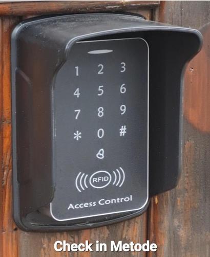 a black remote control attached to a wall at Monteurzimmer Lollar in Lollar