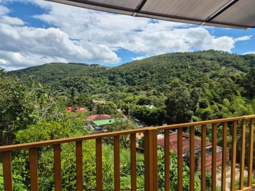 a view from the deck of a house with a mountain at Hotel Campestre Villa Nico in Bochalema
