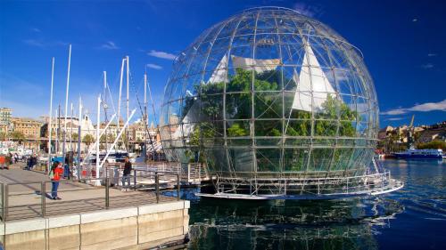 a glass dome on the water with a tree in it at The First Luccoli Garibaldi Rolli in Genova