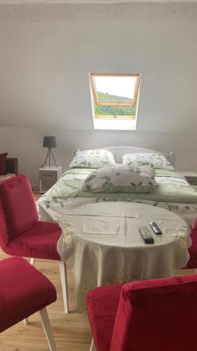 a bedroom with a bed with two remote controls on it at Agroturystyka pod Baranią Gorą in Kamesznica