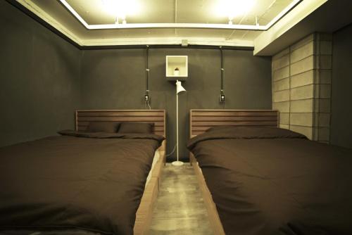 a bedroom with two beds in a room at That House Hongdae in Seoul