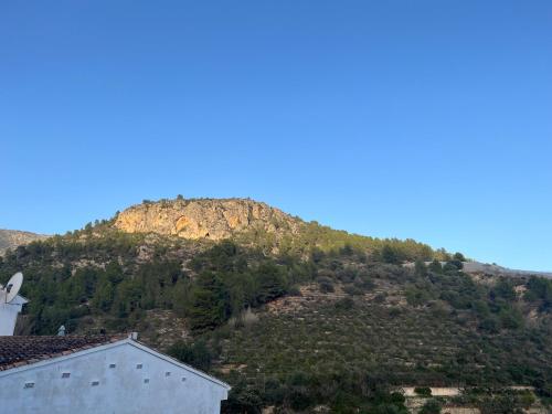 a mountain in the distance with a house at Ca Julia in Bolulla
