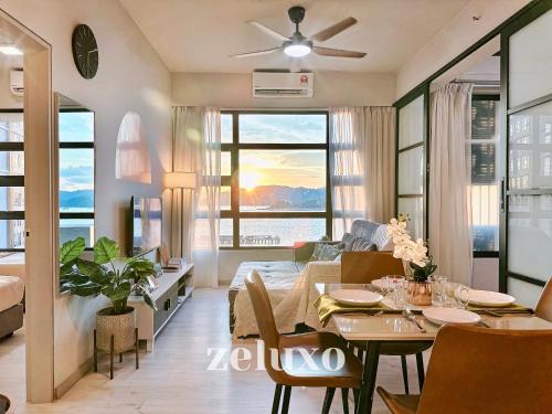 a living room with a couch and a table at Zeluxo #JQ02 Jesselton Quay Tower 2 Level 10-2 BR 1 Bath, Seaview in Kota Kinabalu
