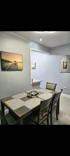 a dining room with a table and some chairs at Blue Water Villa in Point