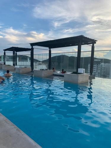 Bazén v ubytování Lujoso Apartamento tipo loft nebo v jeho okolí