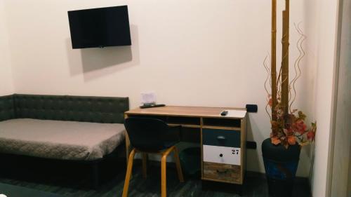 ATTIKO 53 Boutique Roomsにあるテレビまたはエンターテインメントセンター