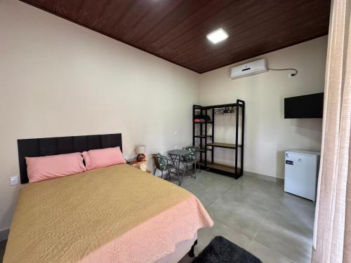 Postel nebo postele na pokoji v ubytování Suíte Canário