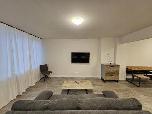 a living room with a couch and a table at Modern townhouse in Wuppertal in Wuppertal
