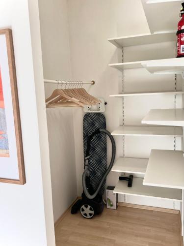 a room with a vacuum cleaner in a closet at Chic Relax - Best located City & Nature Trip Apartment in Mödling