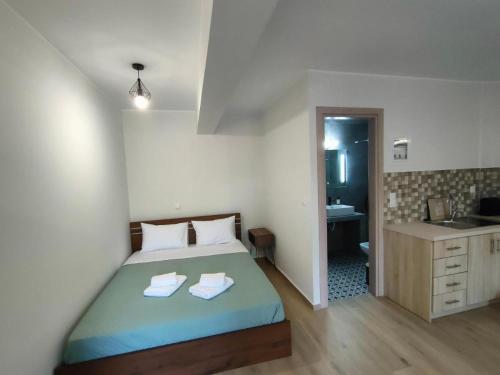 Postel nebo postele na pokoji v ubytování Bella Vita Suites II