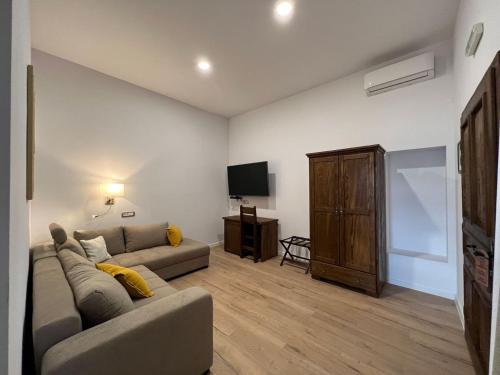 a living room with a couch and a flat screen tv at Csórtok in Lug