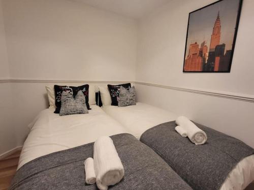 a bedroom with a bed with two pillows on it at Cosy 2 Bedroom Apartment in Stifford